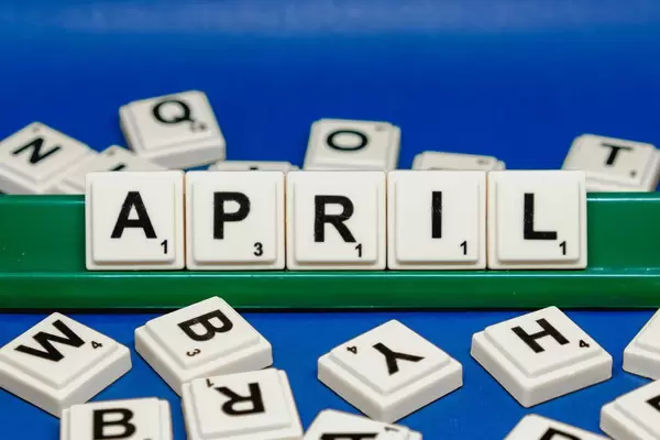 April text on blue background close up shot