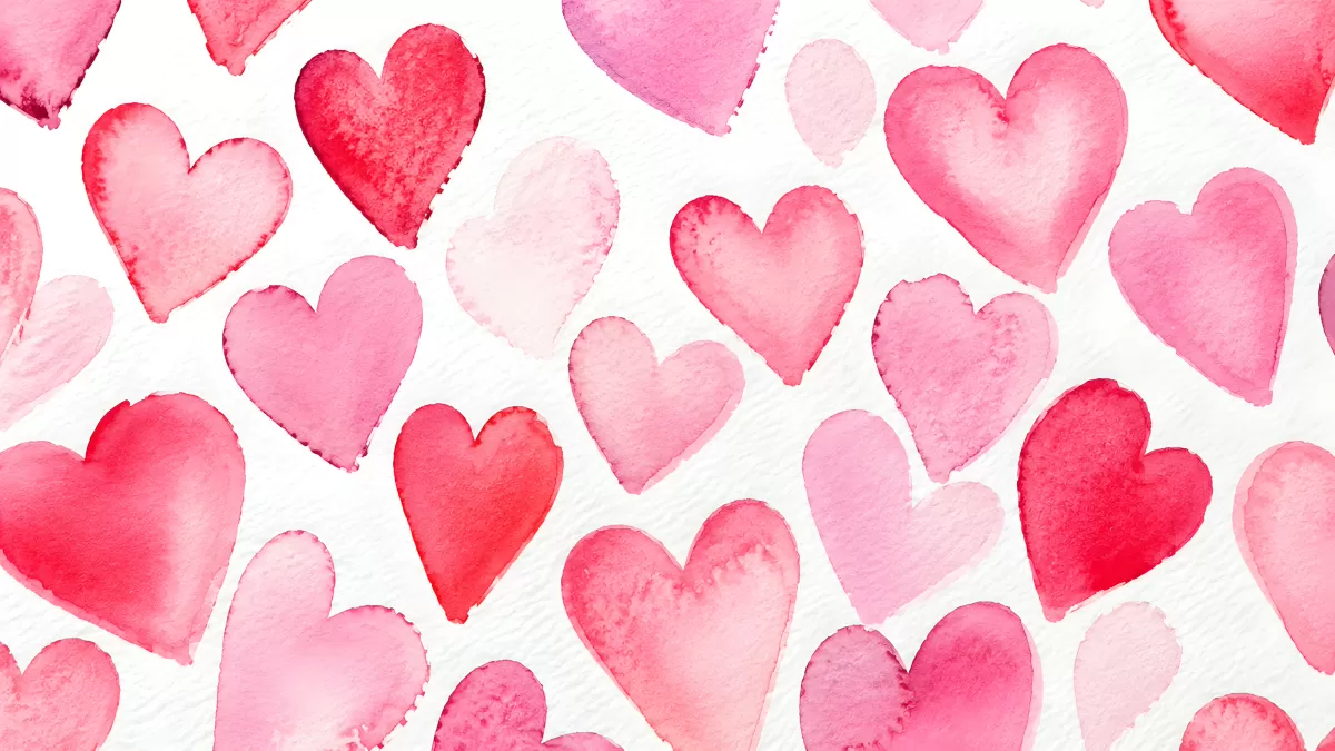 Aquarellierte Herzen in Rot und Rosa auf Weiß