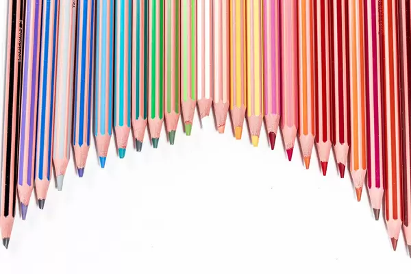 Arc of colored pencils with free space