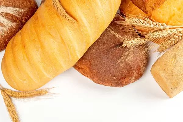 Assorted breads with spikelets on a white background