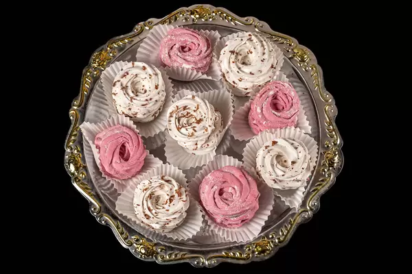Assorted of homemade marshmallows - pink and white zephyr on a tray, top view