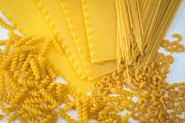 Assortiment of Uncooked Pasta on a White Background
