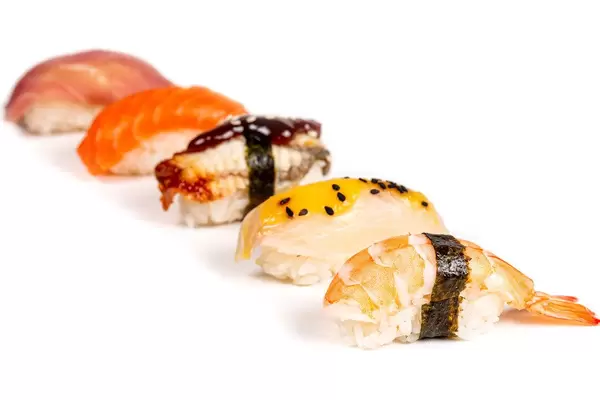 Assortment of nigiri with seafood on a white background