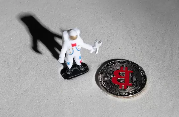 Astronaut and silver Bitcoin on the moon (Flip 2019)