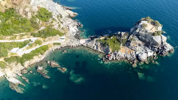 Attractions on Skopelos: the monastery and church on the rock formation next to Agios Ioannis beach