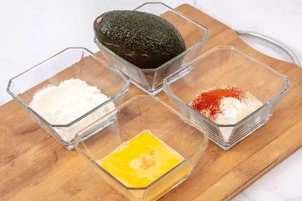 Avocado Flour Eggs and Breadcrumbs with Paprika on the wooden board (Flip 2019)