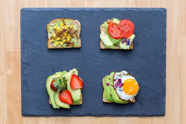 Avocado Sandwiches with Lentil, Strawberries, fried egg and tomatoes