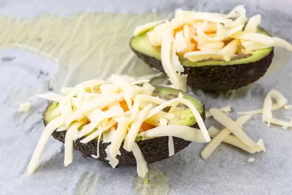 Avocado sliced on the half chicken eggs and grated cheese (Flip 2019)