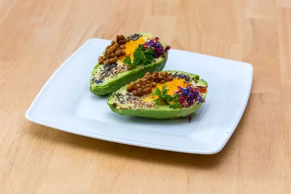 Avocado with Pumpkin Humus, Lentil, Chia and coloured herbs