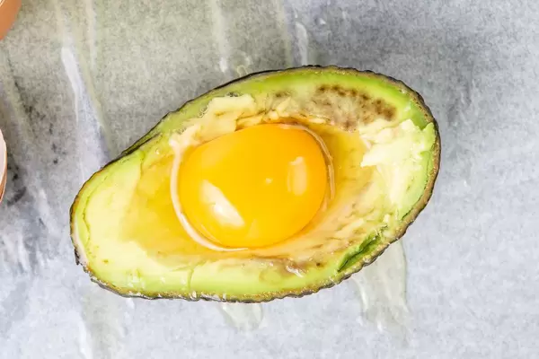 Avocado with raw Eggs ready for baking (Flip 2019)