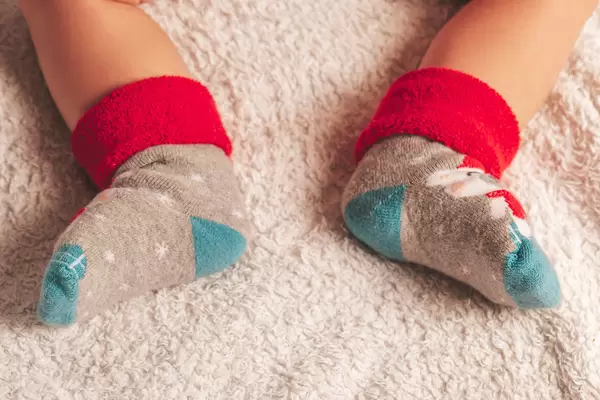 Baby feet in Christmas socks