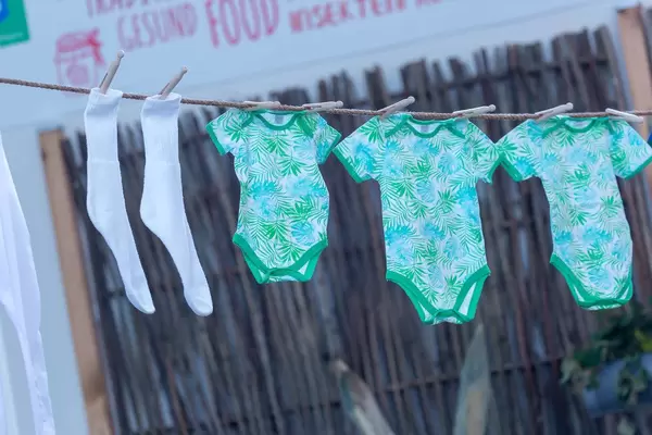 Baby laundry and socks hung out to dry