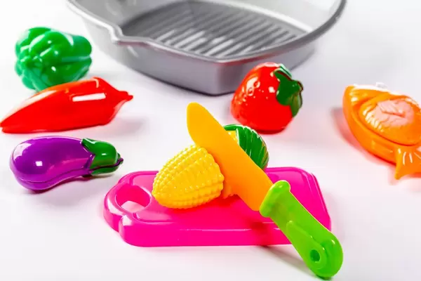 Baby toys vegetables on white background
