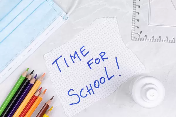 Back to School concept with virus protective masks