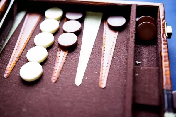 Backgammon game tokens on game board