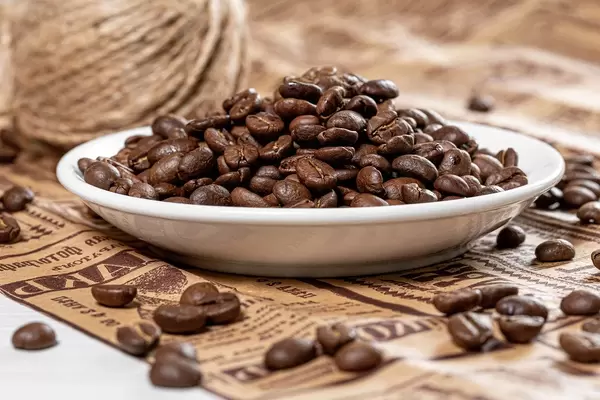 Background of coffee beans on newspaper (Flip 2019)