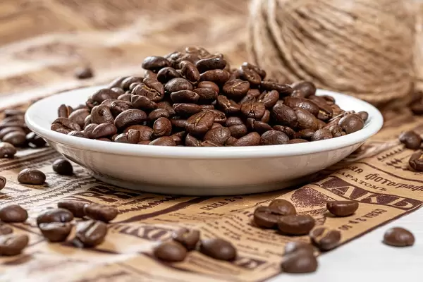 Background of coffee beans on newspaper