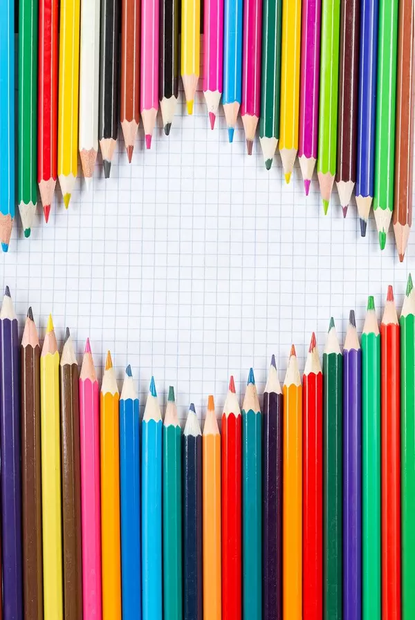 Background of many colored pencils with free rombess on the middle