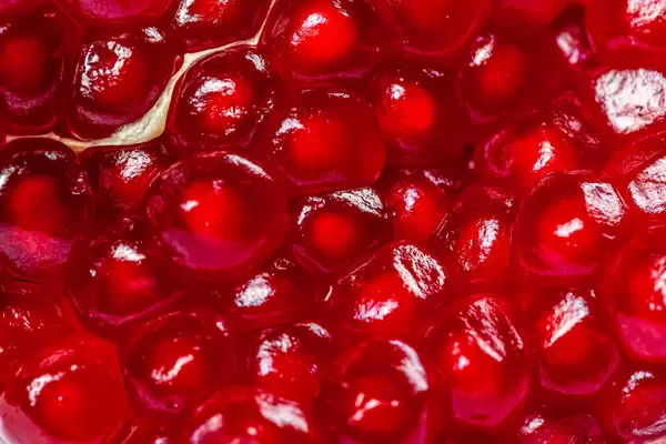 Background of red grain ripe grenades