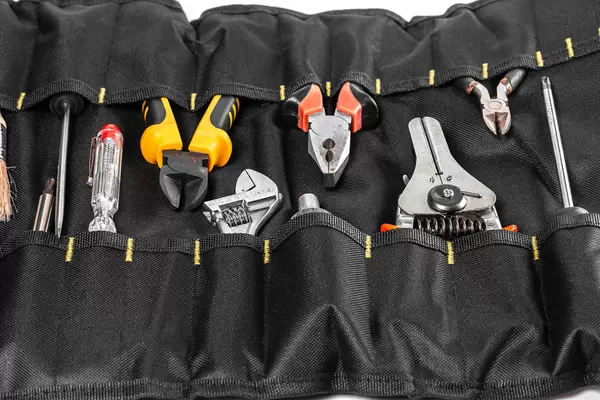 Background of various tools in black bag