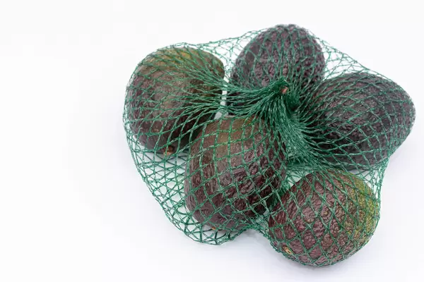 Bag with fresh and delicious Avocados