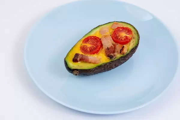 Baked Avocado with Eggs Cherry Tomato and Bacon