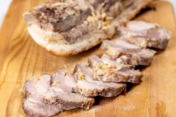 Baked bacon on a wooden kitchen Board (Flip 2020)