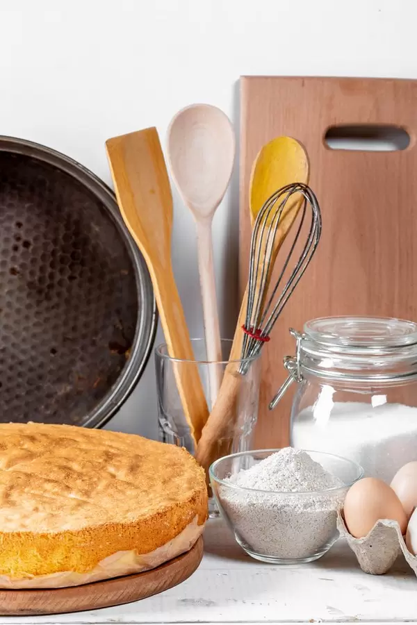 Baked biscuit with flour, sugar, eggs and utensils