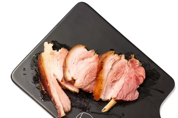 Baked delicious Pork Knuckle isolated above white background