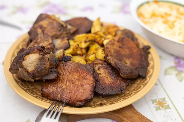 Baked Pork Ribs and Chops with Potatoes served on the plate