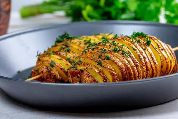 Baked potatoes with herbs on a baking sheet (Flip 2019)