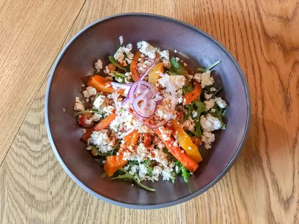 Baked pumpkin and carrots salad with quinoa, chickpea, arugula and feta cheese