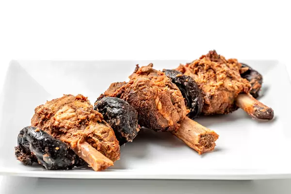 Baked ribs with prunes, close-up