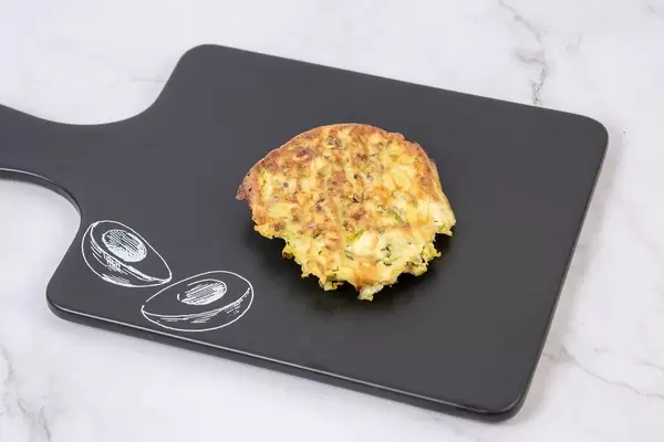 Baked Zucchini Meatballs on the black tray (Flip 2019)