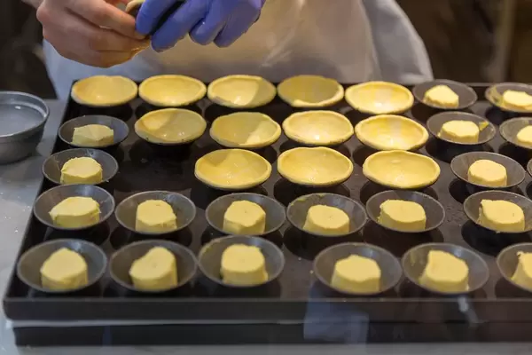 Baker creating pastry in bakery