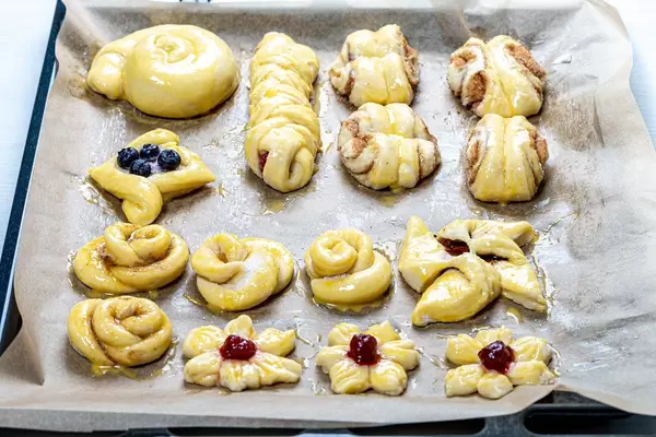 Baking tray with homemade buns ready for baking (Flip 2019)