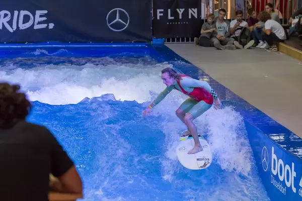Balancing on the board at fair Boot Düsseldorf 2018