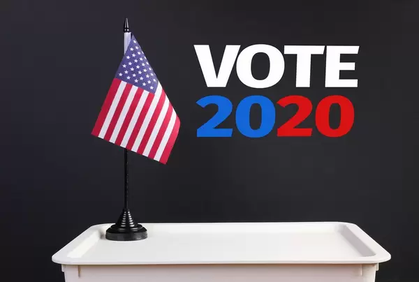 Ballot box with American flag and Vote 2020 text
