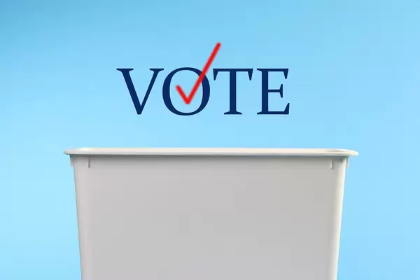 Ballot box with Vote text on blue background