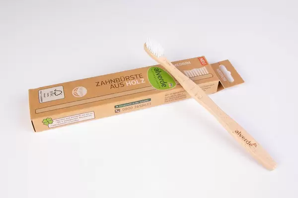 Bamboo toothbrush on white background