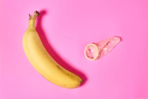 Banana and condom - erotic concept