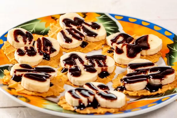 Banana waffle with chocolate on plate
