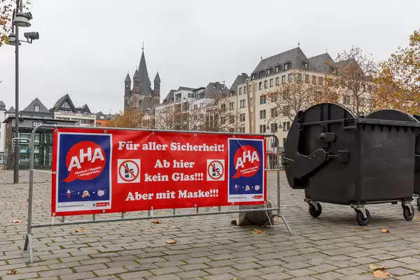 Banner with Covid-19 rules at Heumarkt, traditional location of Cologne's carnival season opening on 11.11