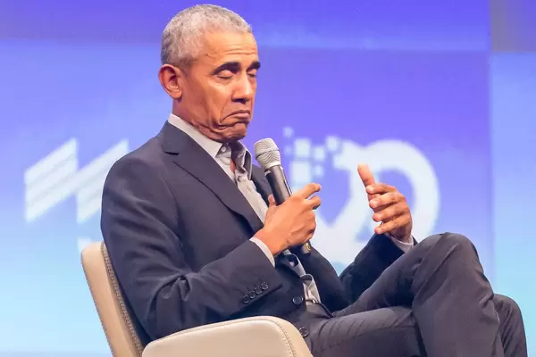 Barack Obama pulls a face during moderated conversation on stage and talks about world leadership