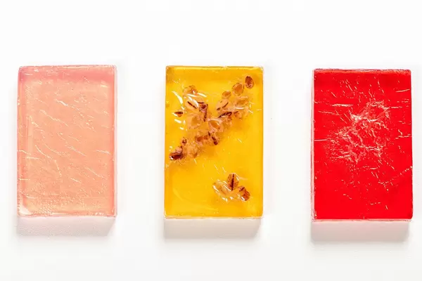 Bars of handmade soap with natural oils on white background. Top view (Flip 2019)