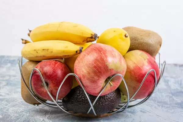 Basket with healthy fruits concept