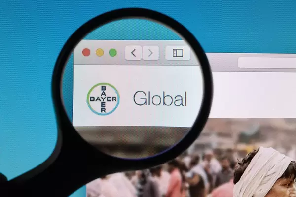 Bayer logo under magnifying glass