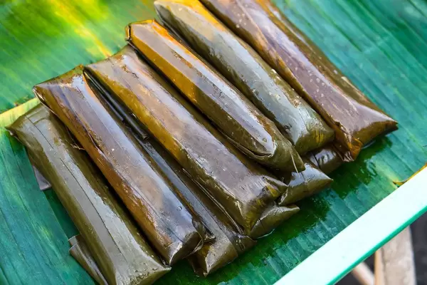 Bayi-bayi street food wrapped in banana leaves
