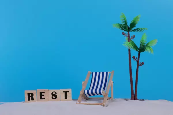 Beach chair and wooden blocks with Rest text