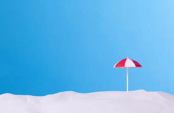 Beach umbrella with blue background
